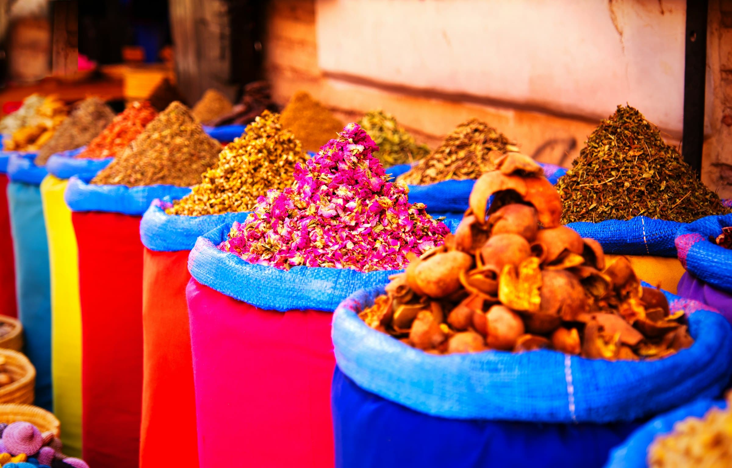 Colourful sacks of spices and dried flowers at a Moroccan market